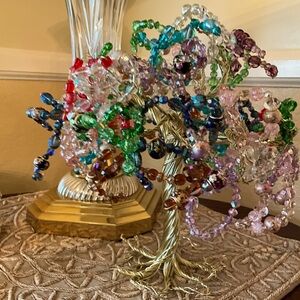A stunning gold tree adorned with Swarovski crystals and hand painted beads